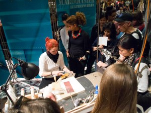 at the leather work station, where we see how a bag handle was painstakingly put together