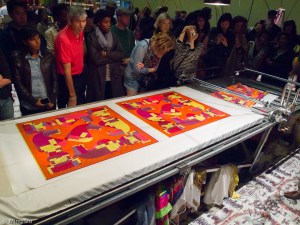 The finish scarfs.  After the printing process, the scarf will go thru additional steps to set and protect the ink, along additional finishing touches